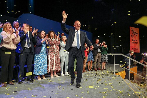 Ed Davey waves to the crowd after speaking to Liberal Democrat conference